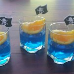 Blue gelatin with an orange slice boat and flag 